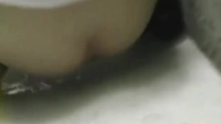 Shitting behind a building in public