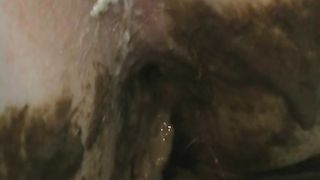 Russian blonde babe shitting on a green bag