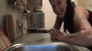 Hot brunette babe shitting in the sink