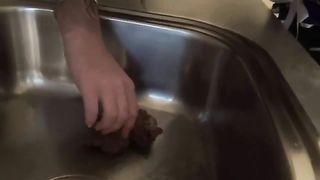 Hot brunette babe shitting in the sink