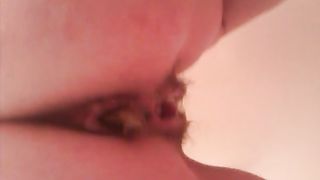 Close up of a girl pooping