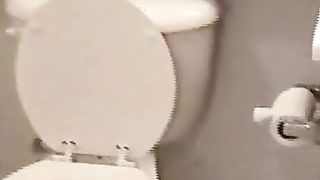 Brunette beauty pooping in the toilet