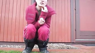 Brunette teen shitting on the grass