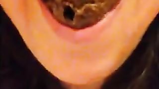 Young girl chewing poop