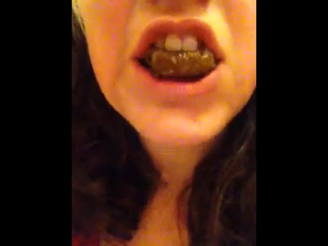 Young girl chewing poop