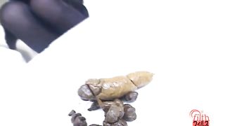 Searching for food in her pile of poop