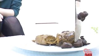 Searching for food in her pile of poop