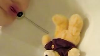 Drunk girl peeing on her teddybear