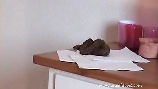 Sexy wife shitting on a wooden table