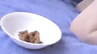 Smearing crap on her face while eating poop