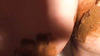 Smearing fresh crap on her entire body