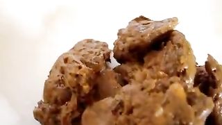 Sweet blonde pooping on a plate