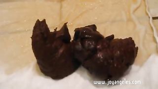 Blonde teen shitting a hard turd in close up