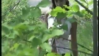 Petite brunette with short hair pooping in nature