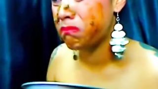 Cam girl eating poop from a bowl