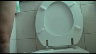 Hot MILF pooping over the toilet