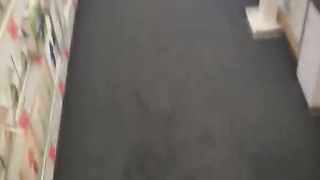 Peeing while walking in a supermarket
