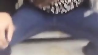 Sexy teen peeing through her blue jeans in public