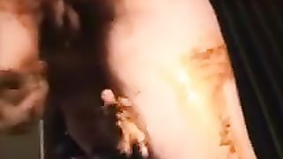 Masked housewife rubbing crap on her body