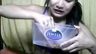 Beautiful Thai pours liquid shit on her own face