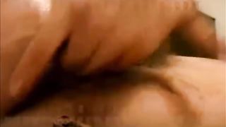 Young brunette fingering her pussy