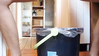 Naked girl pooping in the trash can