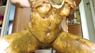 Beautiful babe rubbing shit on her half naked body