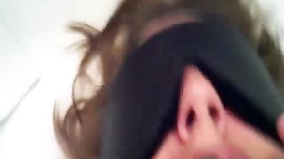 Young girl tied on bed while she's eating poop