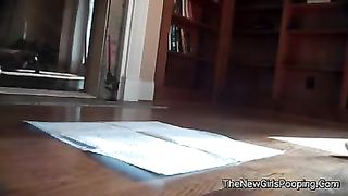 Beautiful teen pooping in a plastic bowl
