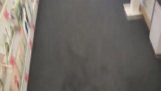 Hot brunette peeing in a store