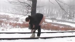 Undress to pee in snow outdoor