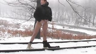 Undress to pee in snow outdoor