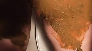 Betty smearing fresh shit on her entire body
