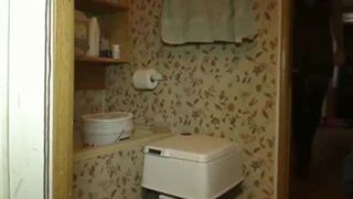 Brunette slut shitting in a white trash can