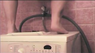 Tattooed girl shitting on a washing machine