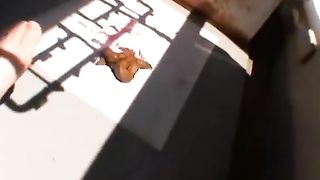 Young Japanese shitting on a balcony