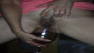 Peeing in a champagne glass