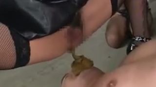 Hot mistress in black latex pooping on her slave