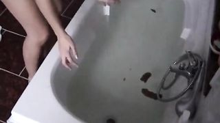 Skinny girl shitting in the bathtub