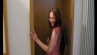 Hot redhead shitting over a toilet