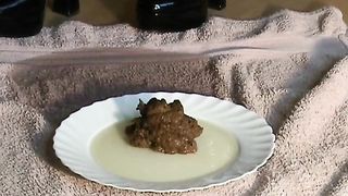Mistress with black boots shitting on a plate