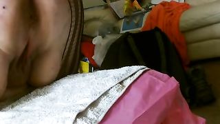 Granny rubbing crap on her big tits