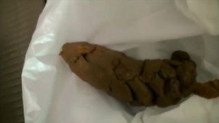 Sexy Japanese woman pooping on a plastic bag