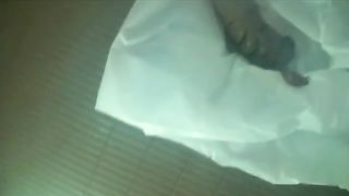 Sexy Japanese woman pooping on a plastic bag