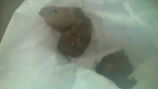 Sexy Japanese woman pooping on a plastic bag