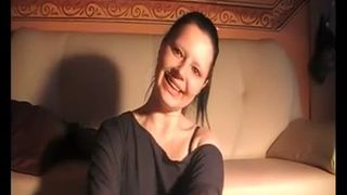 Pretty brunette woman licking a long turd