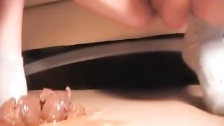 Pretty brunette woman licking a long turd