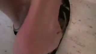 Sexy blonde pooping on her black sneakers