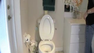 Blonde college girl shitting in the toilet