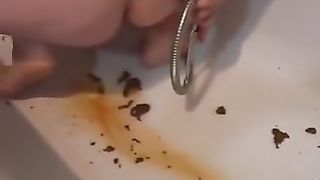 Chubby girl doing enema in the tub